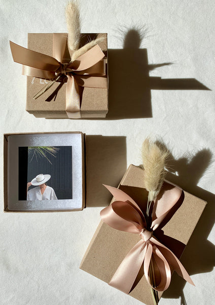 image of gift card in kraft paper gift box with ribbon