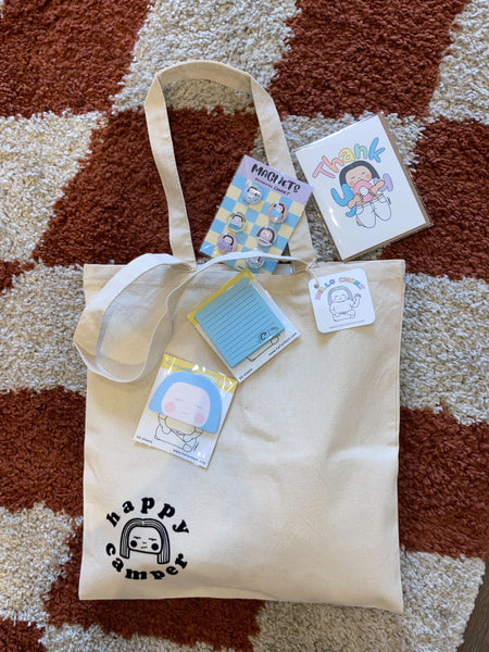a group of stationary items and a tote bag