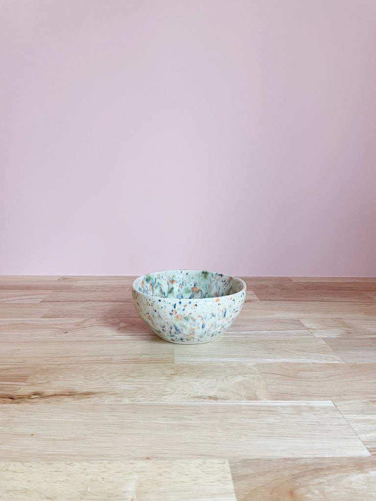 white and multicolor splatter glazed ceramic bowl